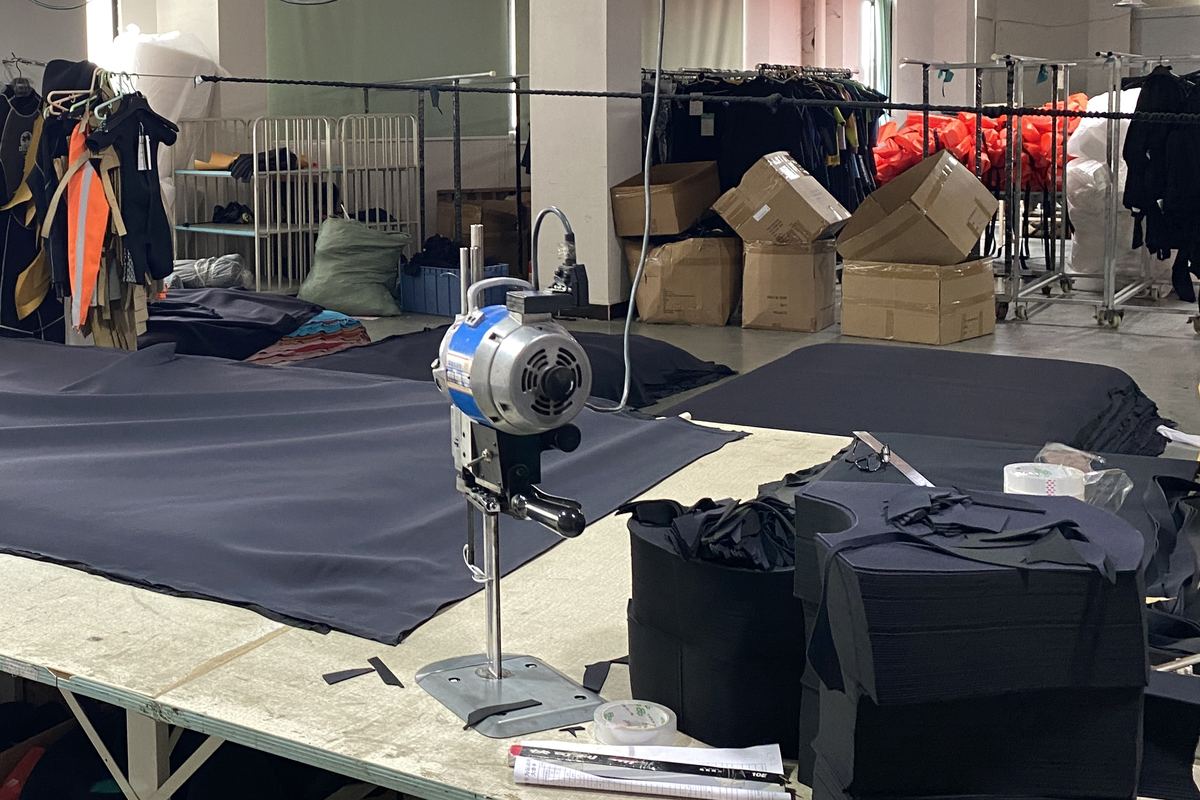 Cutting room — fabric laid out and cut to the approved pattern