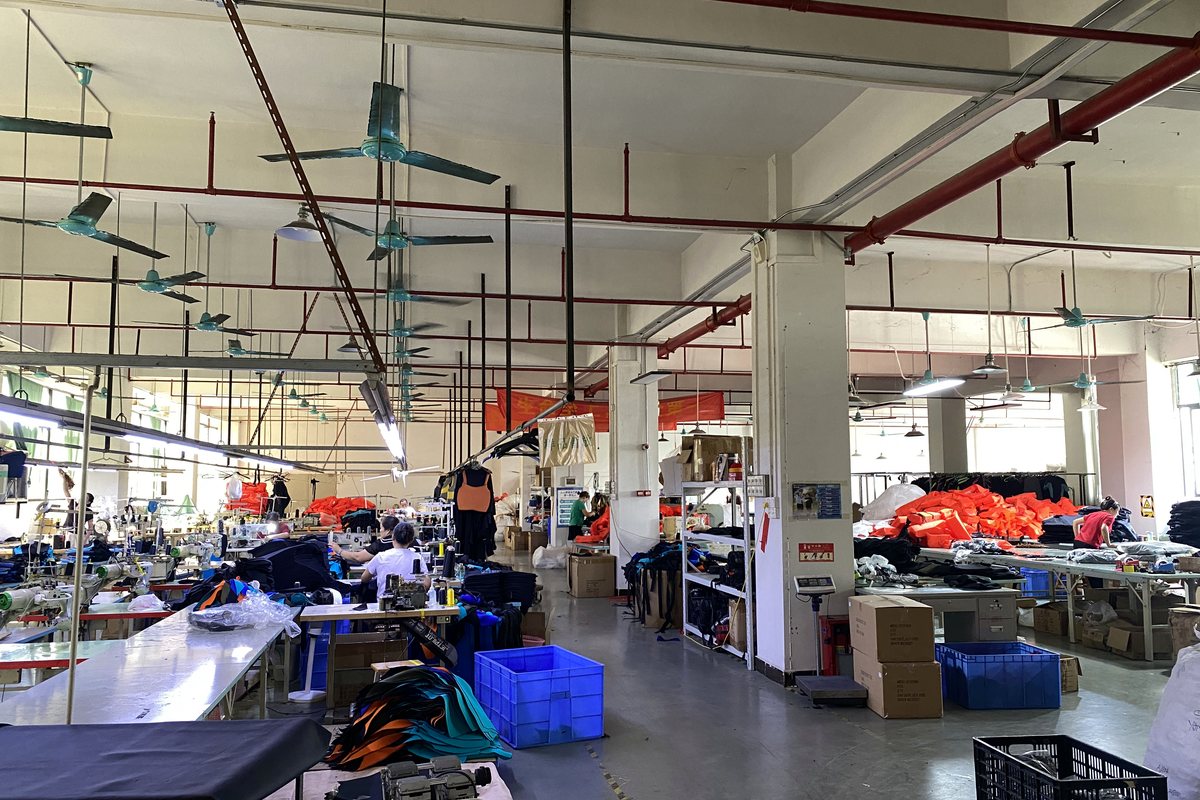 Production floor — Cutting, sewing, inspection and packing under one roof in Dongguan.